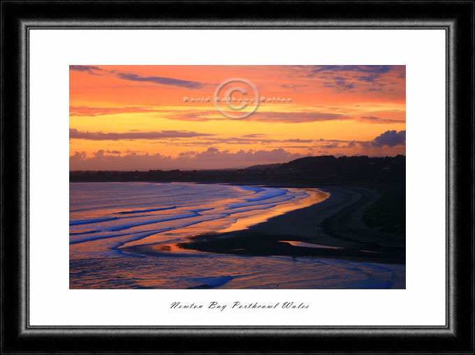 Marmalade sunset photo over Methy Mawr Dunes Newton Porthcawl Wales UK