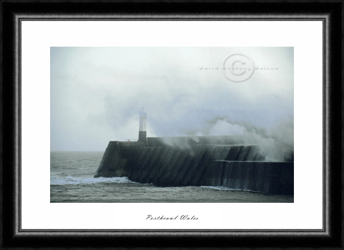 photo of wave breaking over porthcawl pier wales by david anthony batten