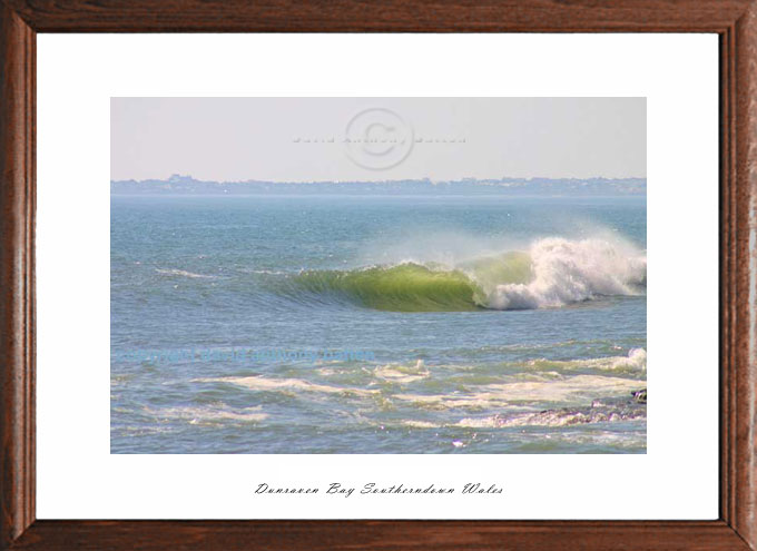 photo of southerndown bay barrelling wave over shallow reef