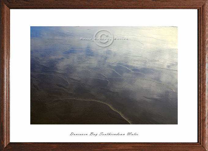 photo of mirrored sky at beach in wales by poet photographer david anthony batten