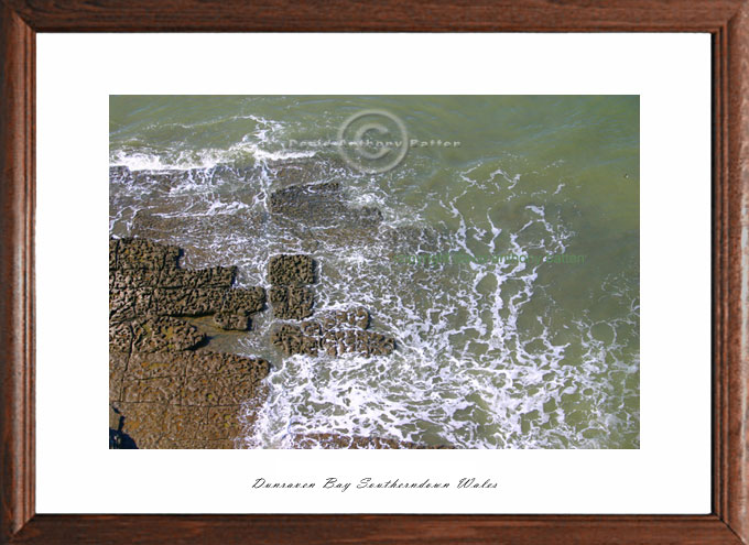 photo of water foam patterns from cliff top at dunraven bay wales by david anthony batten